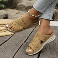 Detail of women's khaki platform slide sandals with laser-cut geometric patterns. - 36 / Brown