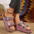 Detailed view of pink rhinestone platform slippers with double buckles and rope trim. - 36 / Pink
