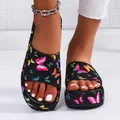 Comfortable black platform slippers with vibrant butterfly print shown on feet with anklet - 36 / Butterfly Print / Black