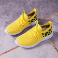 Vibrant yellow mesh women sneakers with leopard print detail and white soles. - Yellow