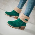 Detailed side view of green suede snow boots with faux shearling collar and chunky heel - 35 / Green
