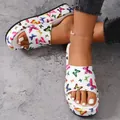 Close-up of white platform slippers with colorful butterfly print on model's feet - 36 / Colorful Butterfly / White