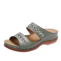 Close-up of olive green vintage wedge sandals featuring intricate embroidered cutouts - 36 / Green