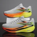 Lightweight grey carbon plate running shoes with vibrant orange and green accents - 35 / Grey Orange