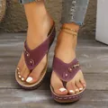 Stylish purple wedge thong sandals with decorative cutouts and metallic accents - 36 / Burgundy