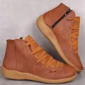 Close-up of brown casual women's ankle boots with side zipper and elastic laces. - 35 / Brown