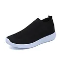 Detail view of black flyknit sock sneakers with breathable mesh and white elastic sole. - 35 / Black