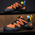 Professional junior climbing shoes with rotary buckle in orange and black for kids - 32 / Orange