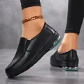 Detail view of black nurse shoes with air cushions and floral perforation design - 35 / Black