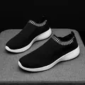 Lightweight black flying knit slip-on sneakers for women with ultra-soft white soles. - 35 / Black
