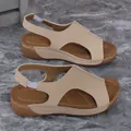 Detail view of beige women's wedge sandals with comfortable elastic strap at heel - Khaki