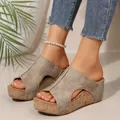 Close-up view of women's platform wedge sandals with rivet details and peep toe style. - 36 / Mule / Khaki