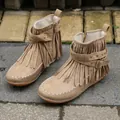 Detail view of tan fringe boots with decorative studs and buckle strap - 36 / Off White
