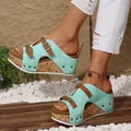 Detailed view of mint green cork platform wedge sandals with adjustable buckle straps. - 36 / Green