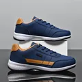 Navy blue faux leather waterproof sneakers with tan accents - 38 / Blue