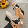 Detailed macro view of women's black canvas wedge sandals with silver studs and buckle - 36 / Black