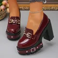 Close-up of gothic burgundy patent platform loafers with gold buckles and studs - 38 / Burgundy