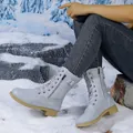 Close-up of stylish grey lace-up boots with side zipper and buckle detail in snow - 35 / Light Blue