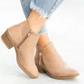 Close-up detail of women's khaki faux suede ankle boots with chunky low heel and side zipper - 35 / Off White