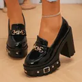 Close-up of black patent leather loafers with 11cm block heel and platform detail - 36 / Black