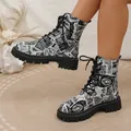Detail of vintage newspaper print lace-up Martin boots for women with chunky soles - 38 / Black and White Print