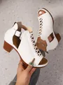 Detail of white block heel sandals with buckle and lace-up design on terrazzo background. - 38 / White