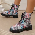 Macro view of vintage stamp print pattern on women's lace-up Martin boots with thick soles - 38 / Colorful Floral