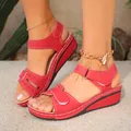 Close-up view of red retro women platform wedge sandals with velcro straps and stitching - 36 / Red