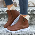 Detail shot of brown winter ankle boots with cozy fleece lining and side zipper. - 36 / Brown