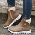 Detail shot of brown women's snow boots with plush fleece lining and side zipper - 36 / Tan