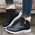 Detail view of women's black snow boots featuring a side zipper and warm fleece lining. - 36 / Dark Blue