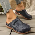 Stylish navy blue laser-cut leather mules for women featuring a cute bow and comfortable flat sole - 36 / Navy Blue