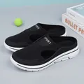 Close-up of black mesh slip-on mules with white thick soles and SPORT logo detail - 36 / Black