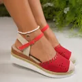Stylish red closed-toe wedge sandals featuring laser-cut hollow details and buckle ankle strap. - 36 / Red