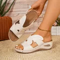 Elegant butterfly cutout sandals detail showing the cream leather texture and stitching - 38 / White