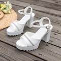 White platform sandals with rhinestone strap and chunky heel on a wooden deck - 38 / Rhinestone Platform Block Heel Style (YD2605W094088) / White