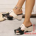 Dettaglio dei sandali con zeppa che mostra il tacco platform intrecciato da 8 cm. - 38 / Beige Nero Color Block