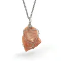 Irregular orange natural raw stone pendant necklace featuring silver wire wrapping. - Sunstone (Wire Wrapped) / Silver