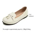 Comfortable beige women's slip-on loafers with stylish tassel and decorative stitching - 38 / White