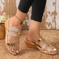 Detailed view of women's gold glitter wedge sandals with stylish triple straps. - 35 / Gold