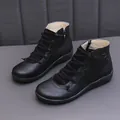 Women's stylish black flat short boots featuring decorative laces and convenient side zipper - 35 / Black