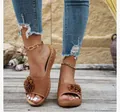 Brown wedge platform slippers featuring elegant flower detail and perforated design - 36 / Tan