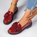 Elegant wine red patent leather loafers featuring a large bow and chunky sole - 36 / Red