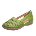 Close-up of green women's sandals featuring laser-cut triangles and soft wedge soles. - 35 / Green