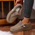 Close-up detail of women's plush brown warm loafers with fuzzy sheepskin-like texture - Khaki