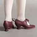 Detailed side view of burgundy vintage-style lace-up pumps featuring hollow patterns - 35 / Burgundy