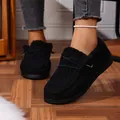 Close-up of black fuzzy winter loafers with thick soles and decorative metal detail - 36 / Black