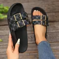 Detailed view of black double buckle platform slides with patterned straps - 36 / Black