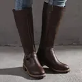 Detail showing texture of brown tall riding boots with side zipper and ankle buckle. - Dark Brown