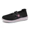 Women's black fly-knit mesh slip-on shoes with pink accents and breathable design - 34 / Black